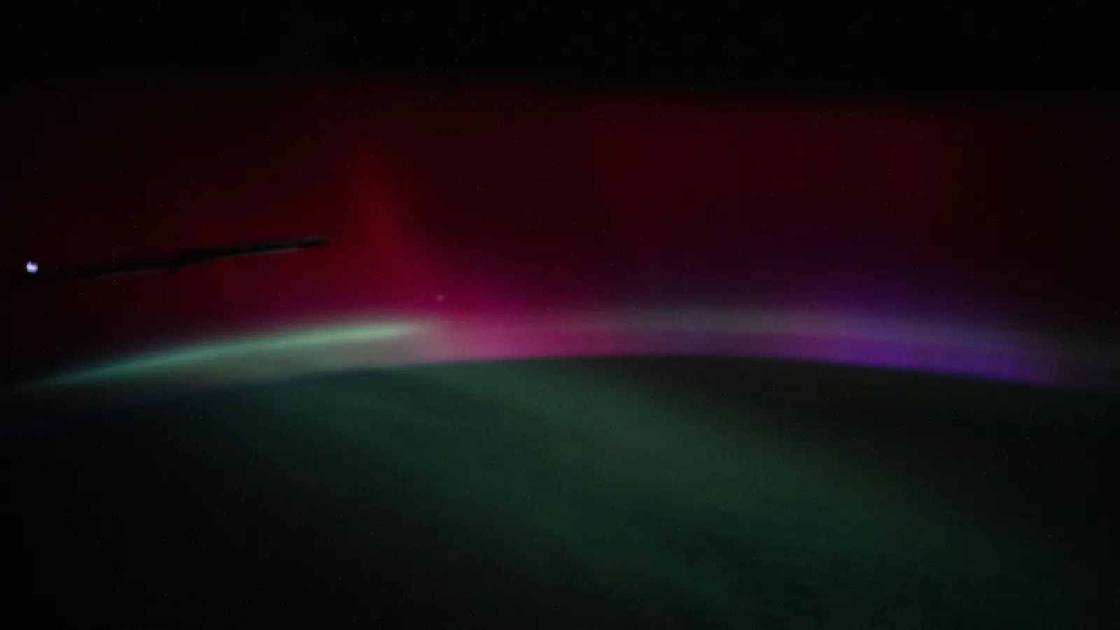 A deep red, purple and green aurora from a geomagnetic storm, photographed from the International Space Station above the Atlantic Ocean off Portugal on January 19, 2026