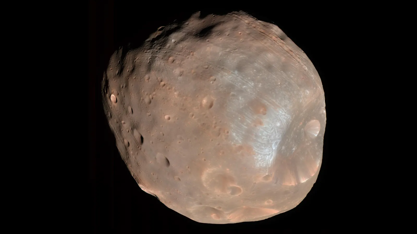Phobos, the larger of Mars's two moons, in colour from the HiRISE camera on NASA's Mars Reconnaissance Orbiter, about 6,800 kilometres away on March 23, 2008, with the large crater Stickney at lower right